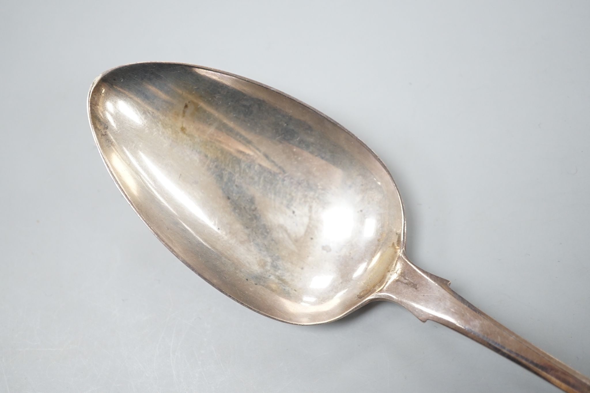 A George III silver fiddle pattern basting spoon, William Seaman, London, 1816, 31.5cm, 109 grams.